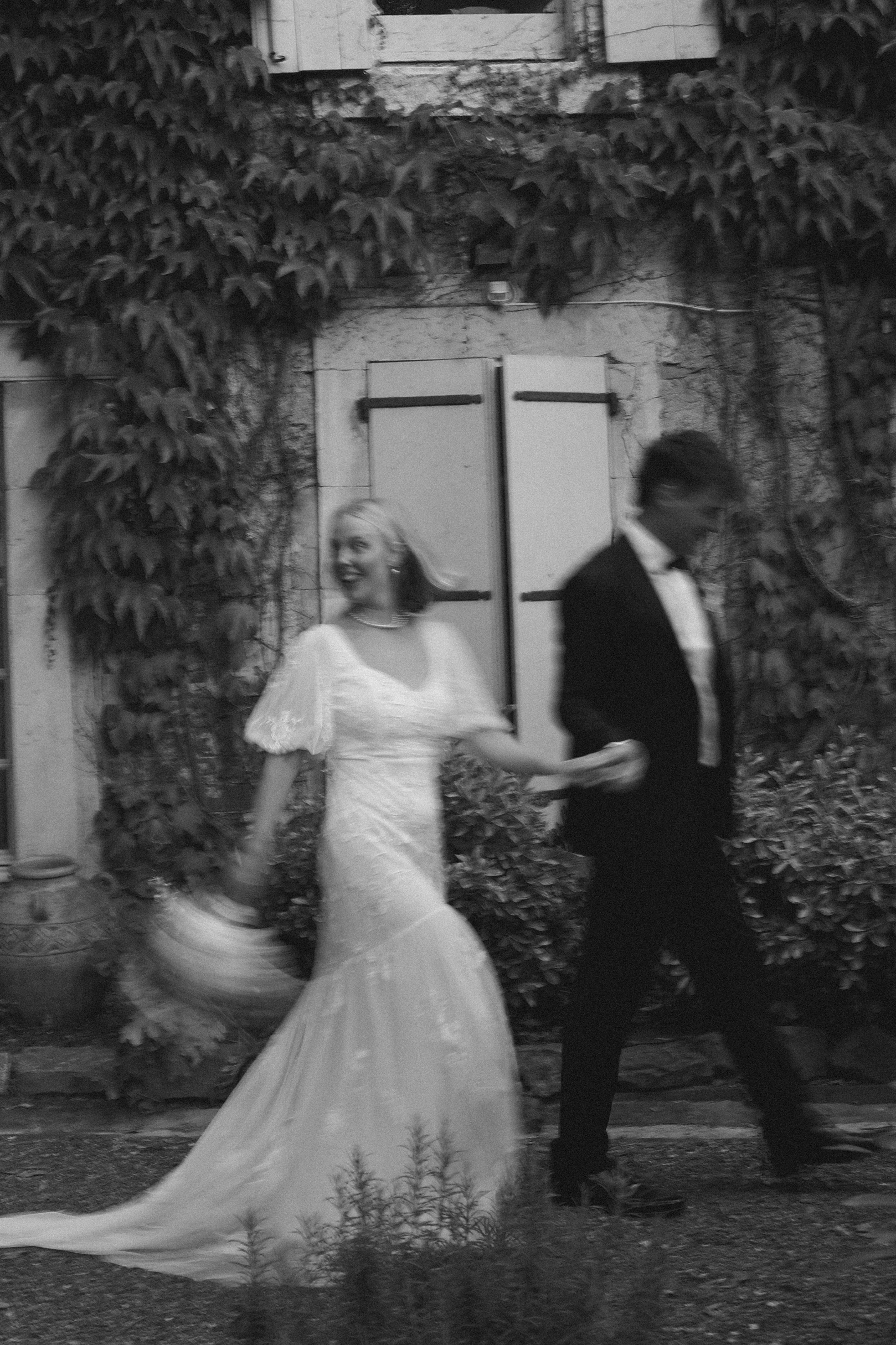 Black and white motion blur of couple walking at Chateau du Puits es Pratx, Ginestas