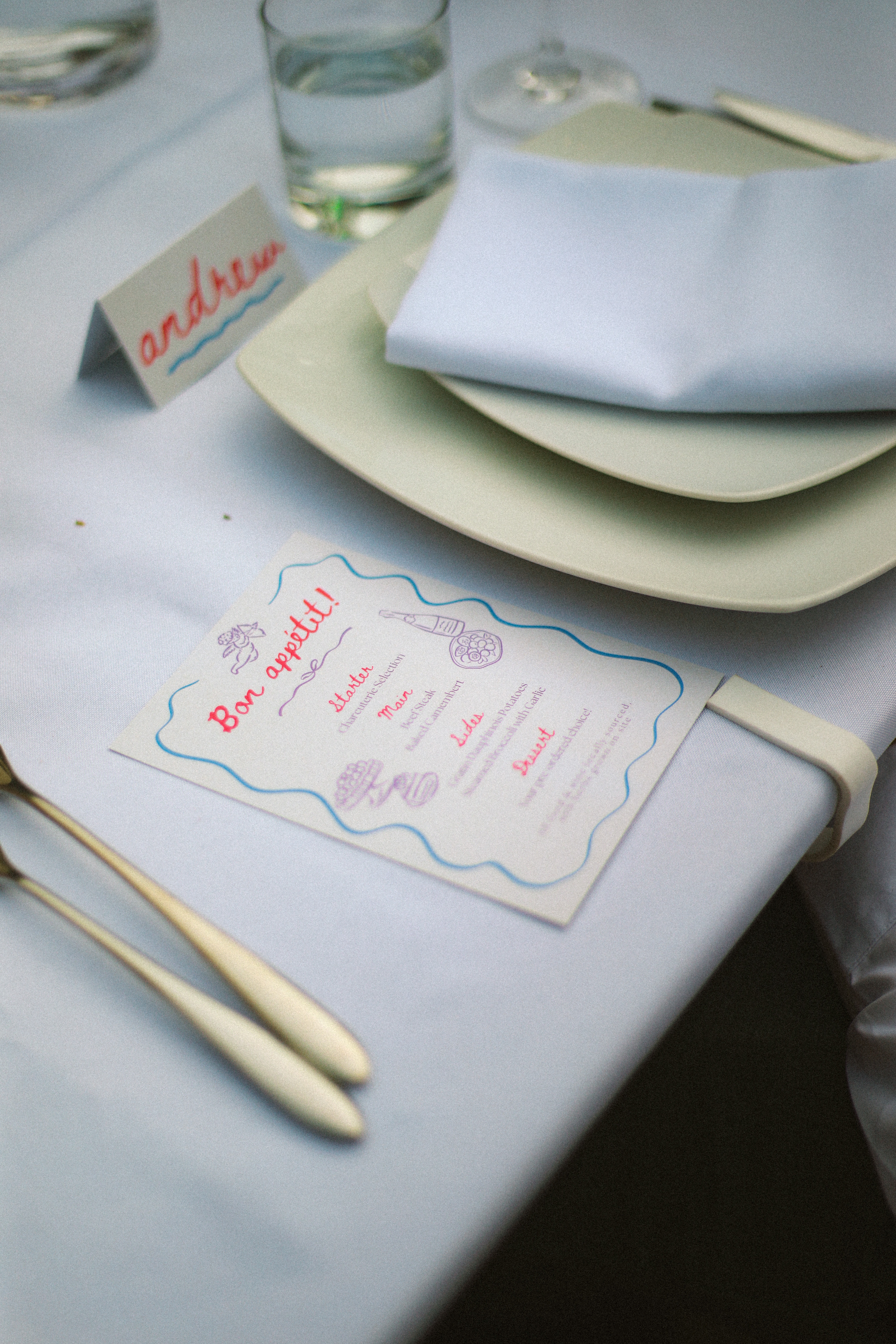 Place setting with illustrated menu card and name card at Chateau du Puits es Pratx, Ginestas