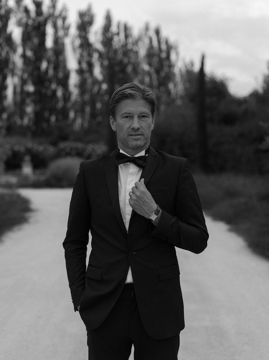groom portrait on cypress-lined drive at La Bastide de Laurence, Provence