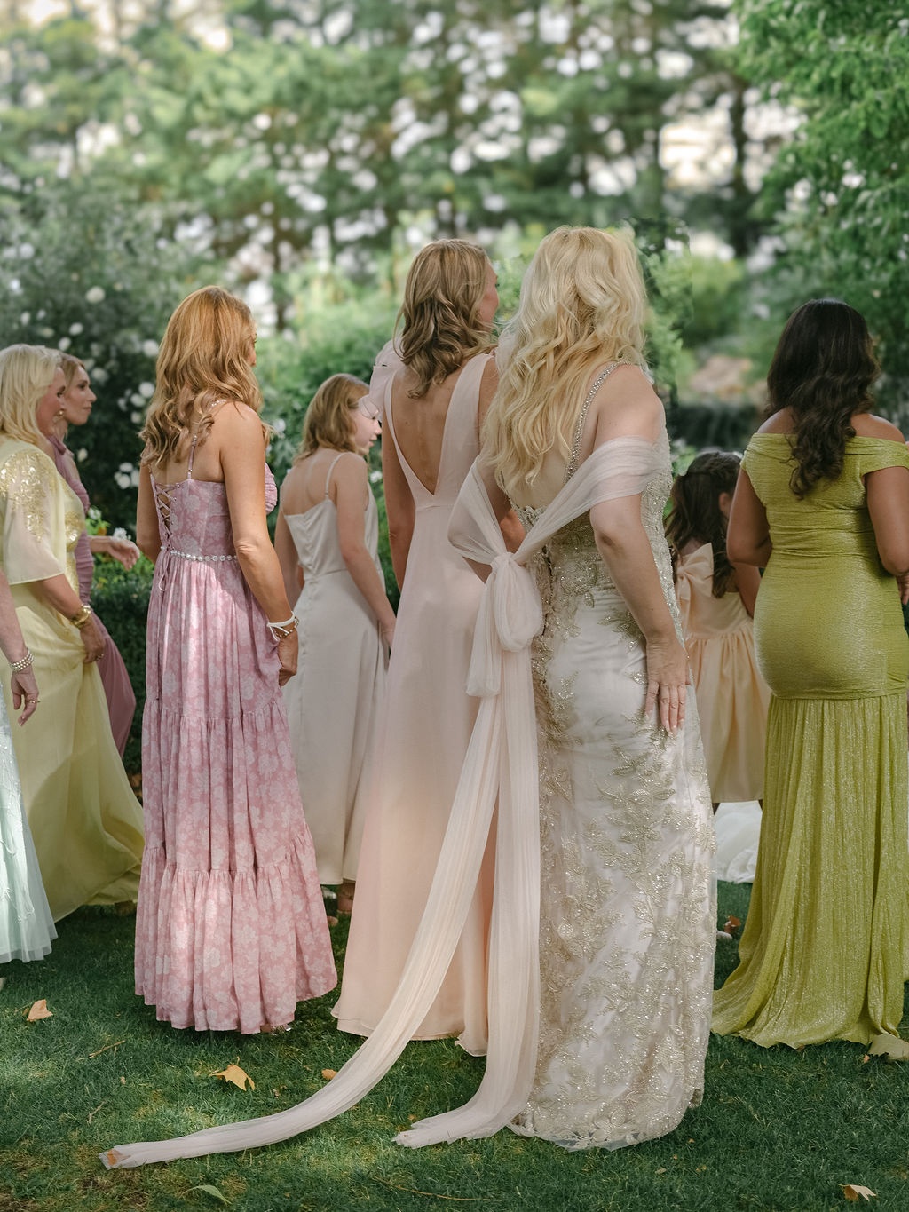 guests gathered beneath plane trees in pastel silks at La Bastide de Laurence, Provence