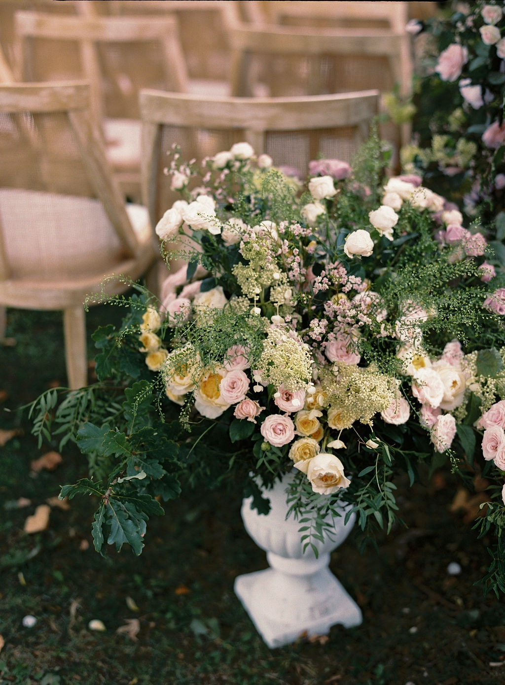 pedestal urn of garden roses by the aisle at La Bastide de Laurence, Provence