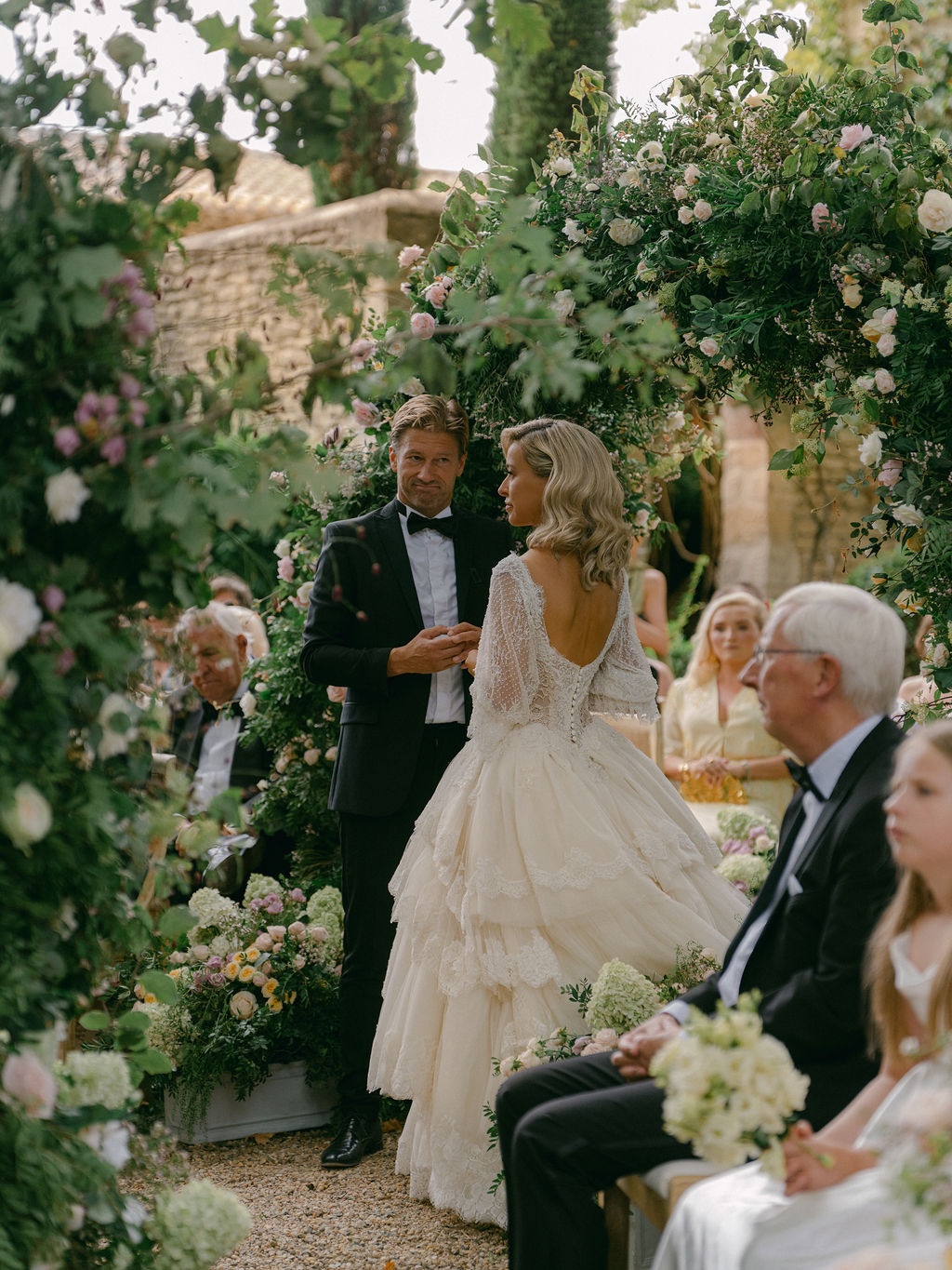 ceremony recessional with guests standing at La Bastide de Laurence, Provence