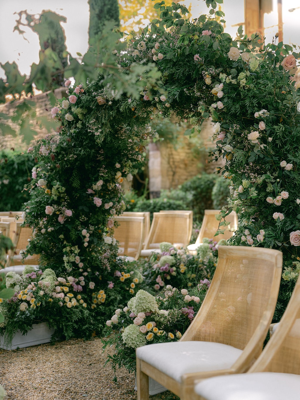 first kiss framed by the garden arches at La Bastide de Laurence, Provence