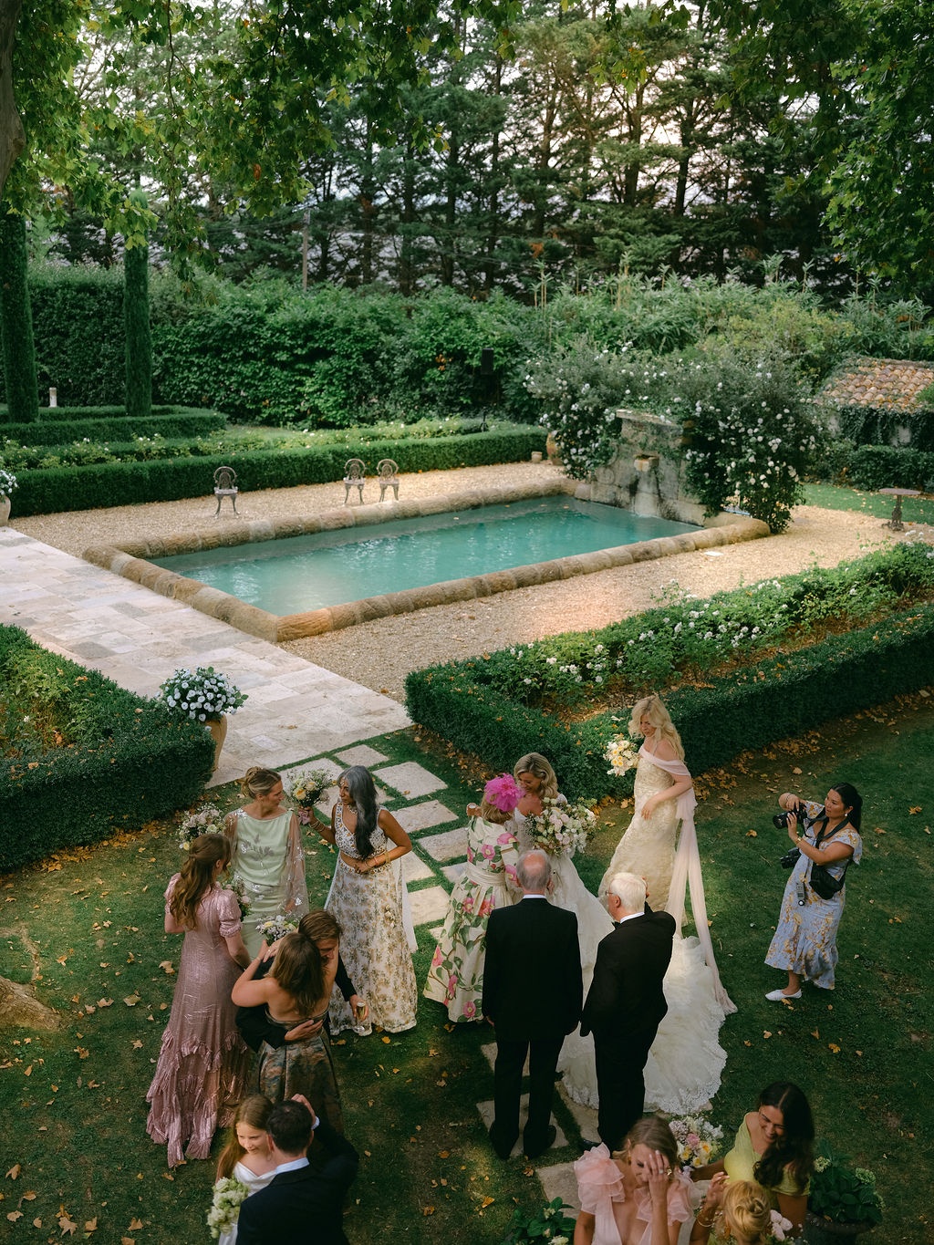bride laughing with a bridesmaid during cocktails at La Bastide de Laurence, Provence