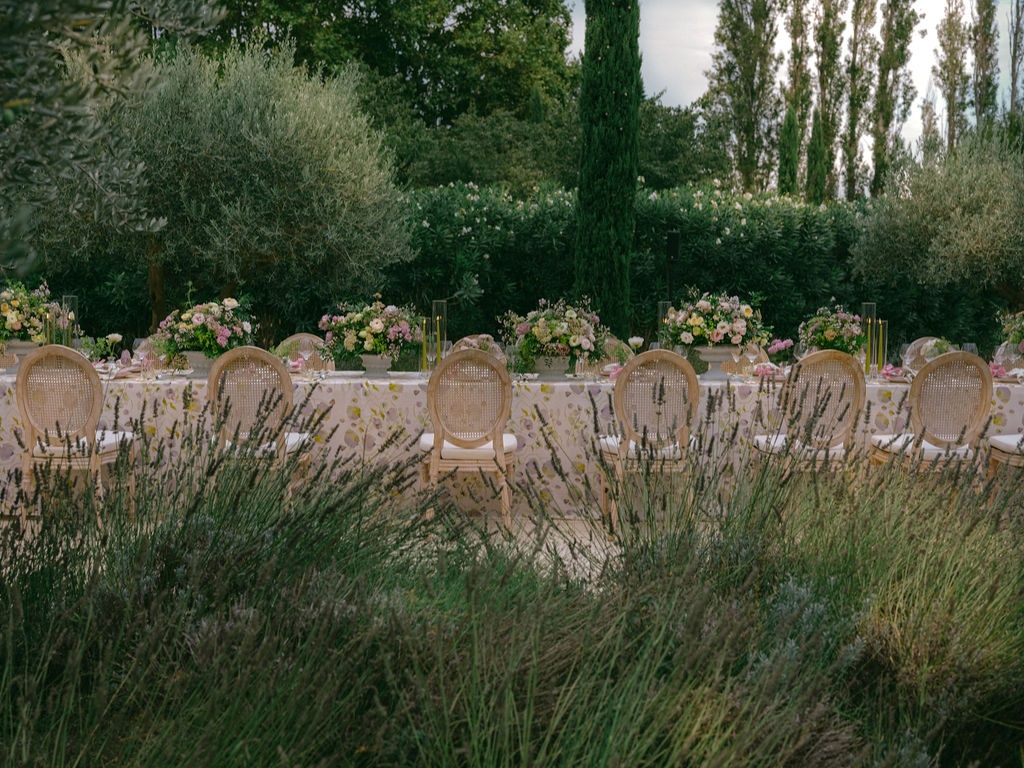 bride lifting a coupe for a toast at La Bastide de Laurence, Provence