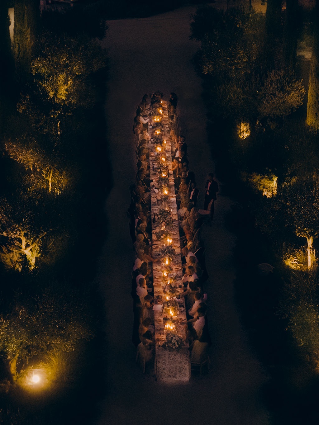 aerial of the candlelit dinner table at night at La Bastide de Laurence, Provence