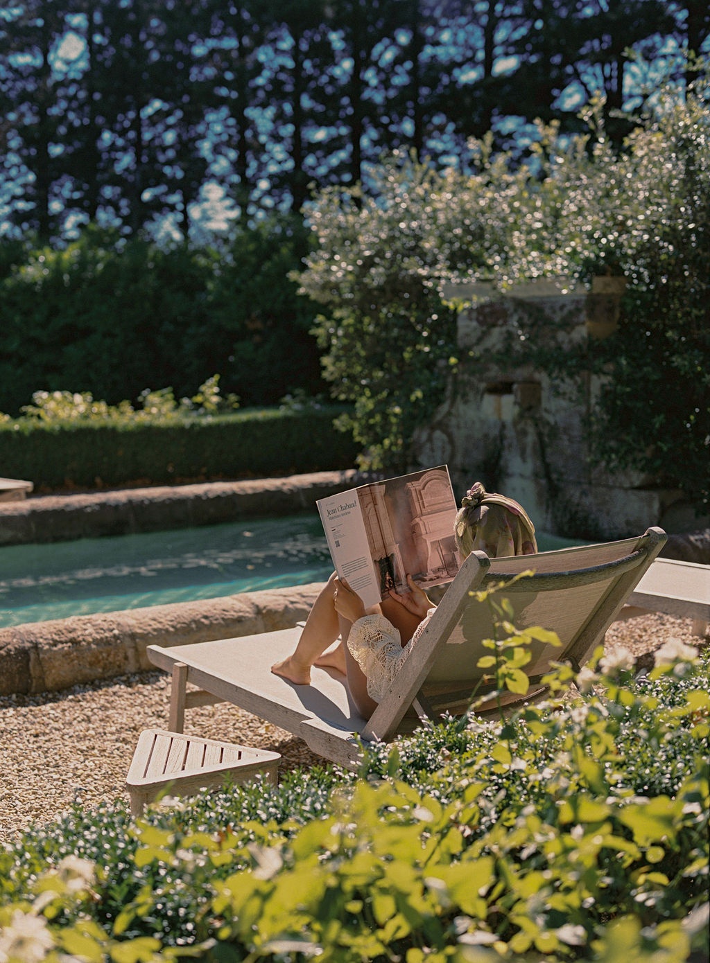 bride's dress laid across an antique chair at La Bastide de Laurence, Provence