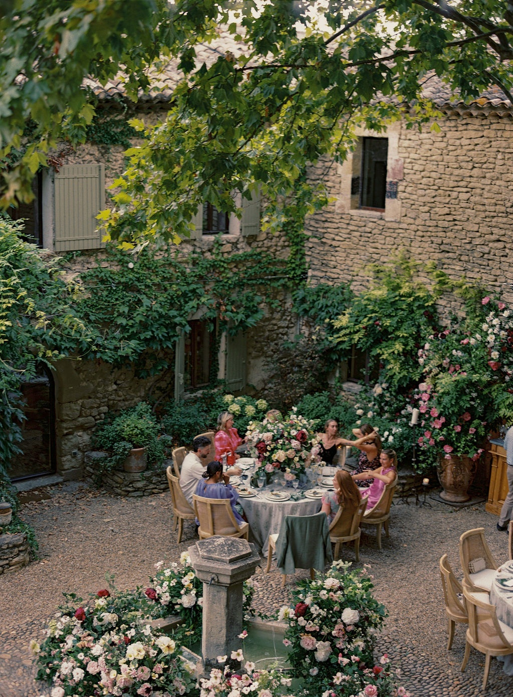 bride laughing with guests at the welcome dinner at La Bastide de Laurence, Provence
