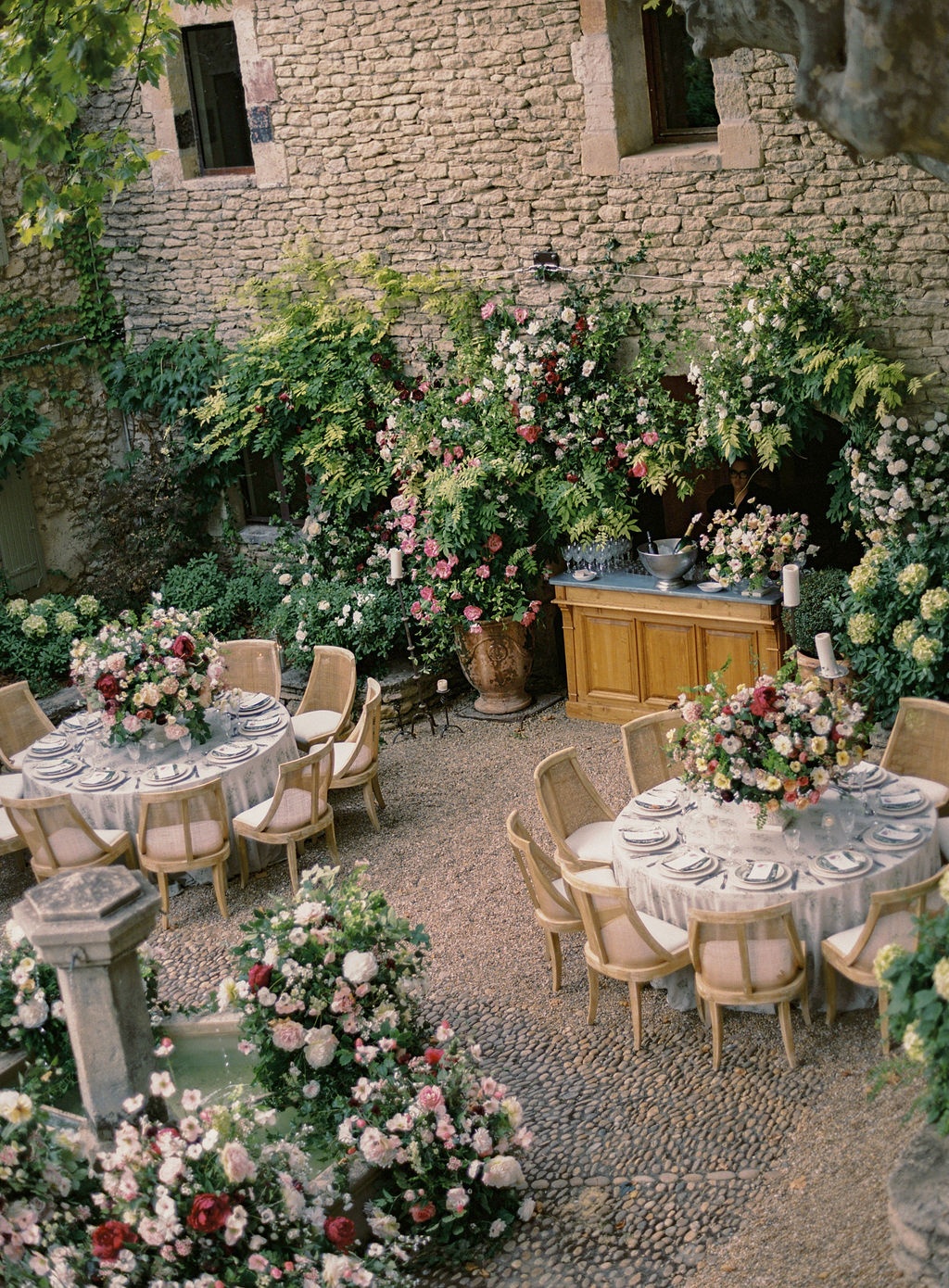 guests toasting beneath the wisteria at La Bastide de Laurence, Provence