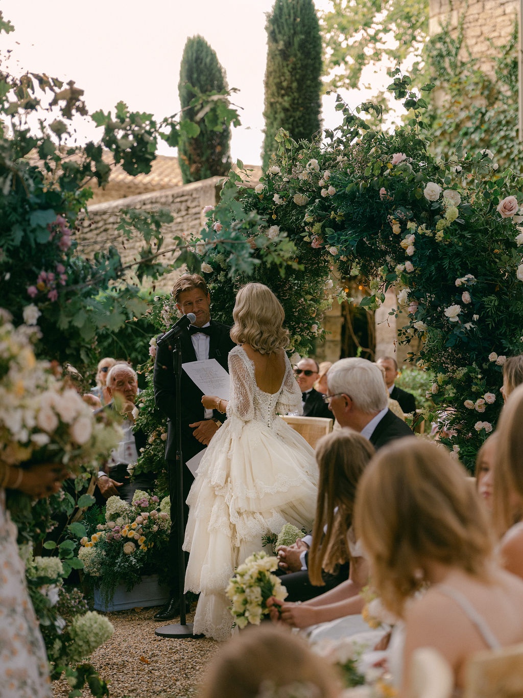 couple framed by floral arches during vows at La Bastide de Laurence, Provence