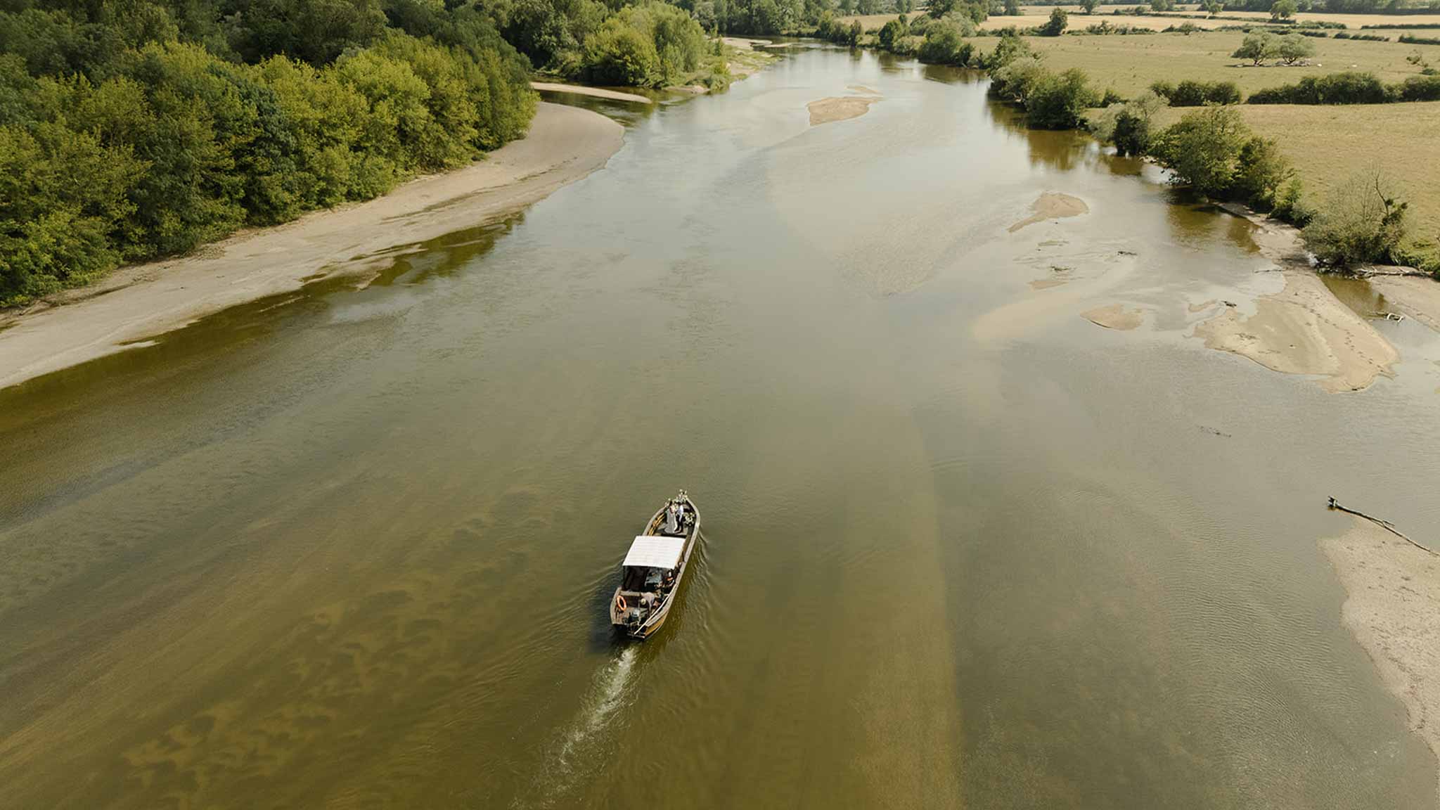 Aerial view of boat on the Allier river at Plage d'Apremont-sur-Allier Burgundy