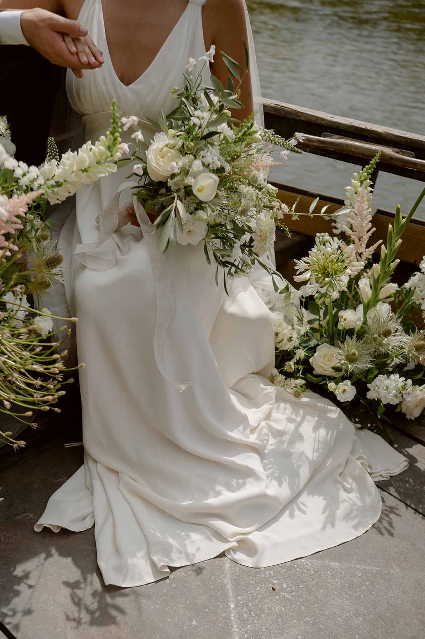Couple in flower-filled boat on river at Plage d'Apremont-sur-Allier