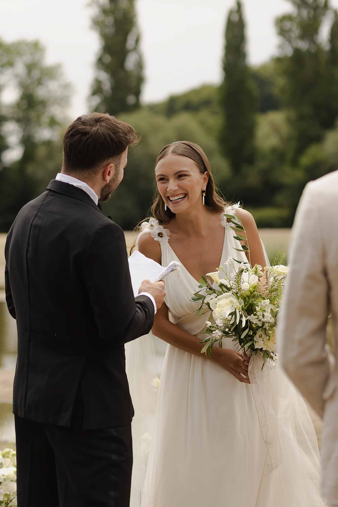 Vow exchange at riverside ceremony at Plage d'Apremont-sur-Allier Burgundy