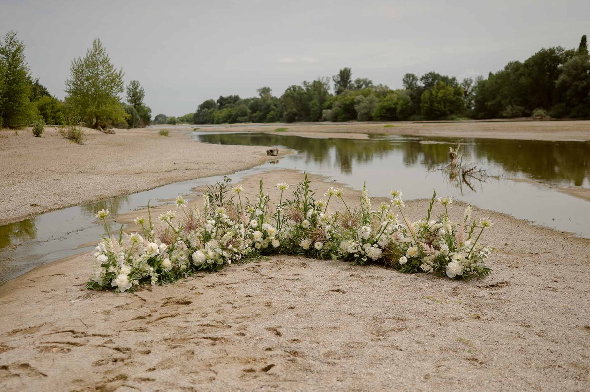 Wildflower ceremony installation on riverbank at Plage d'Apremont-sur-Allier