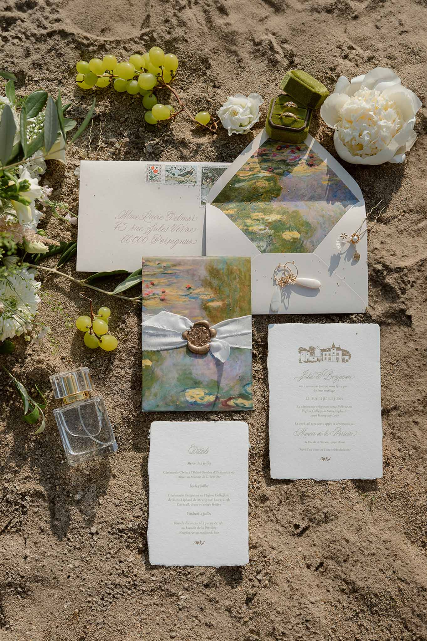 Monet-inspired stationery flatlay on sand at Plage d'Apremont-sur-Allier