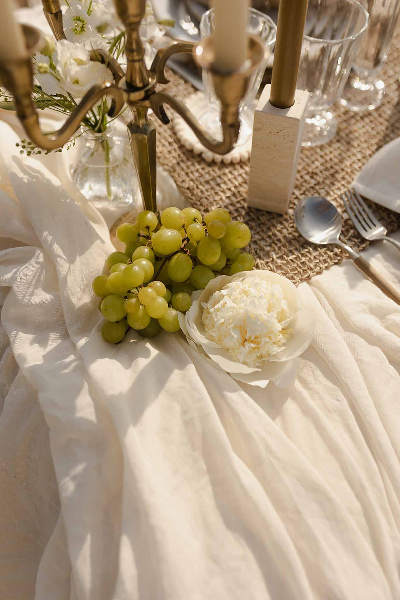Grapes and peony beside gold candelabra at Plage d'Apremont-sur-Allier reception