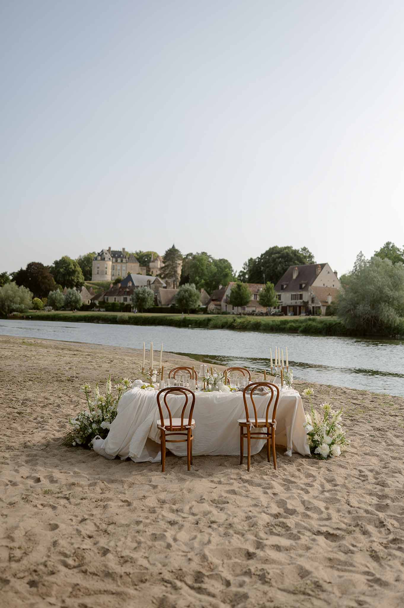 Reception table on sand with chateau view at Plage d'Apremont-sur-Allier