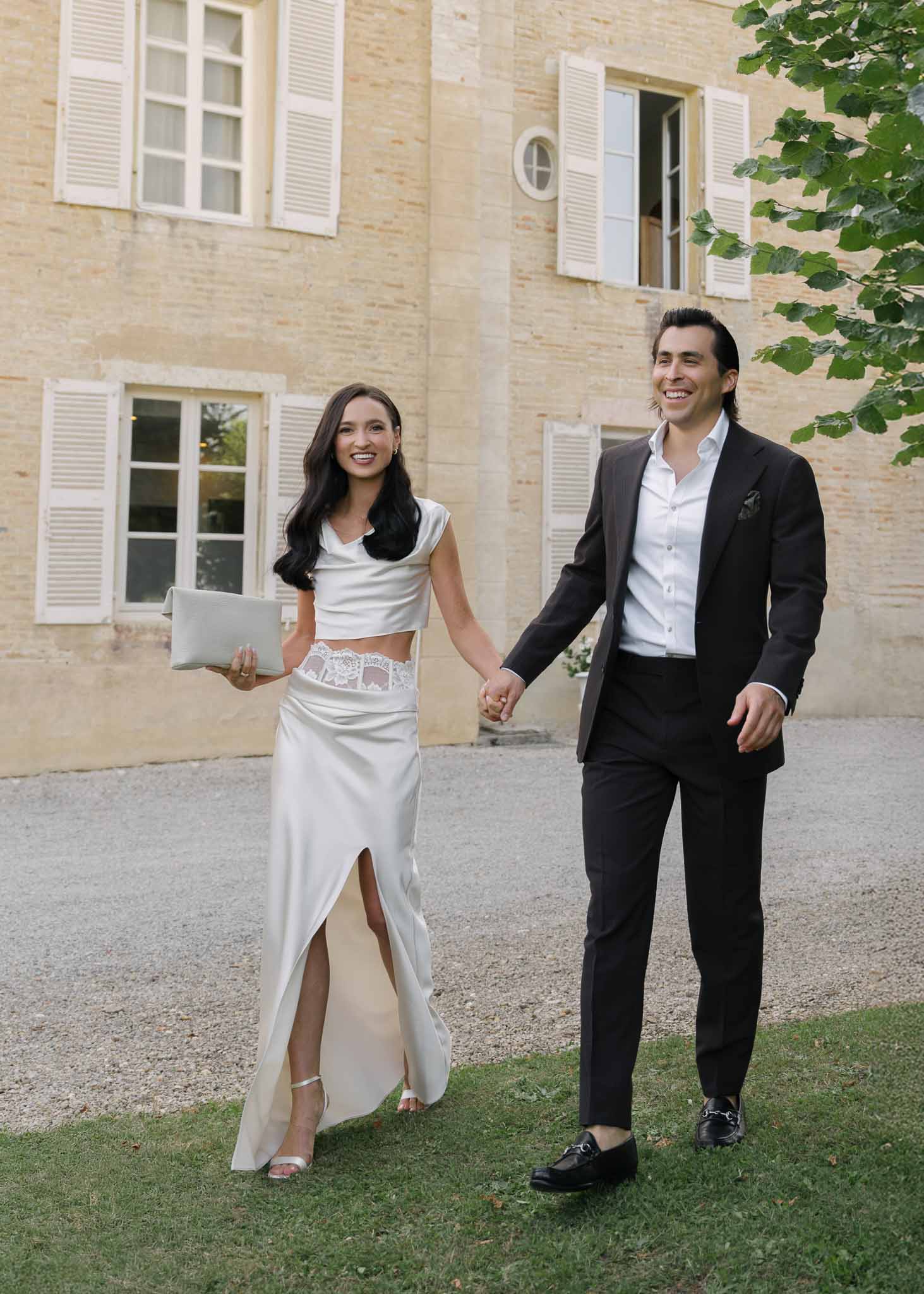 Bride and groom walking hand in hand