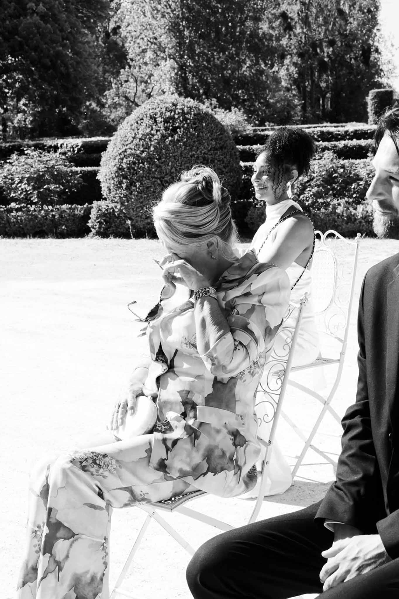 Black and white photo of wedding ceremony in a garden