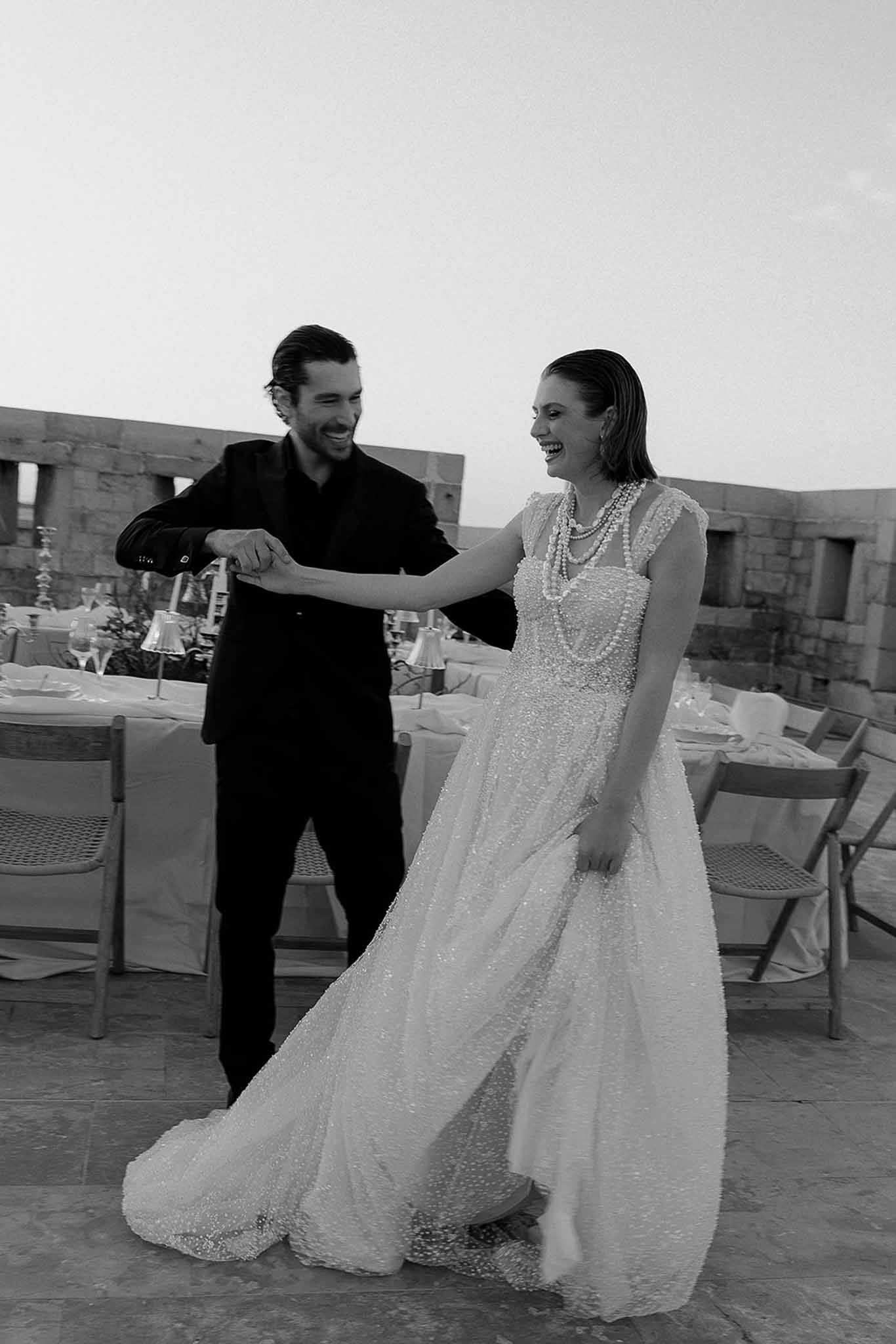 Black and white photo of wedding reception table setting