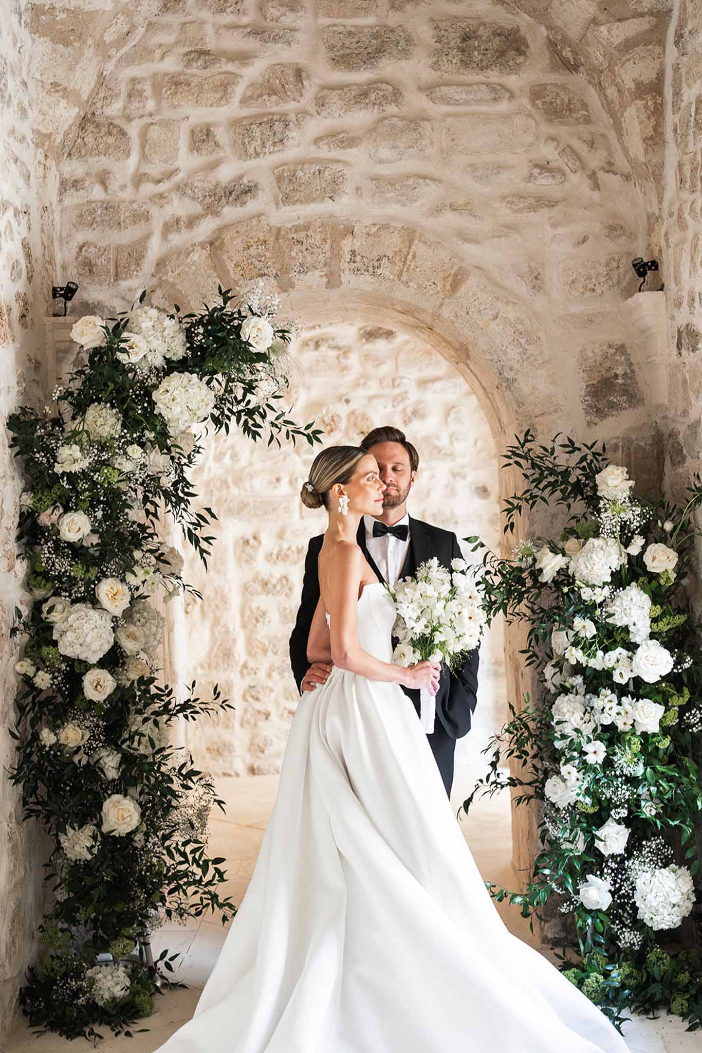 Bride and groom portrait in a garden