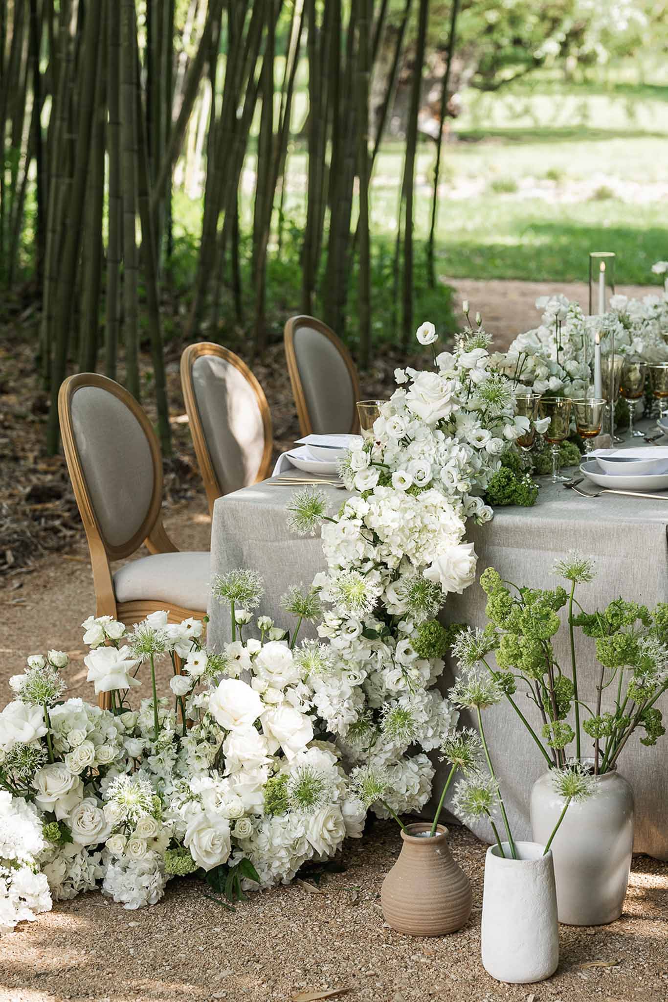 Wedding reception table setting with white roses