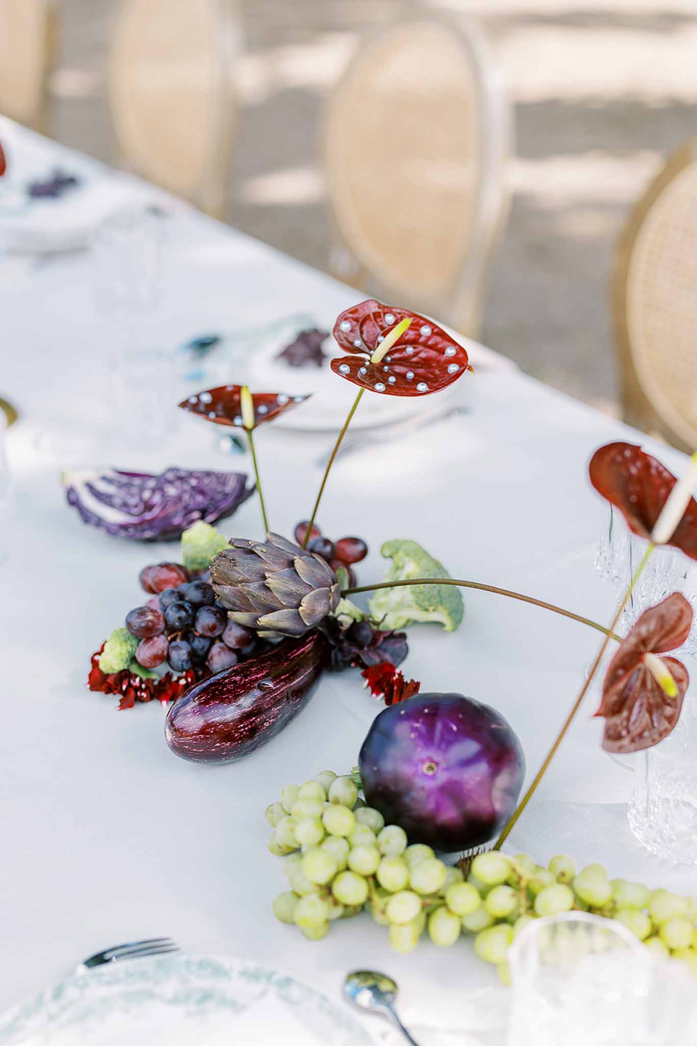 Wedding reception table setting with white roses