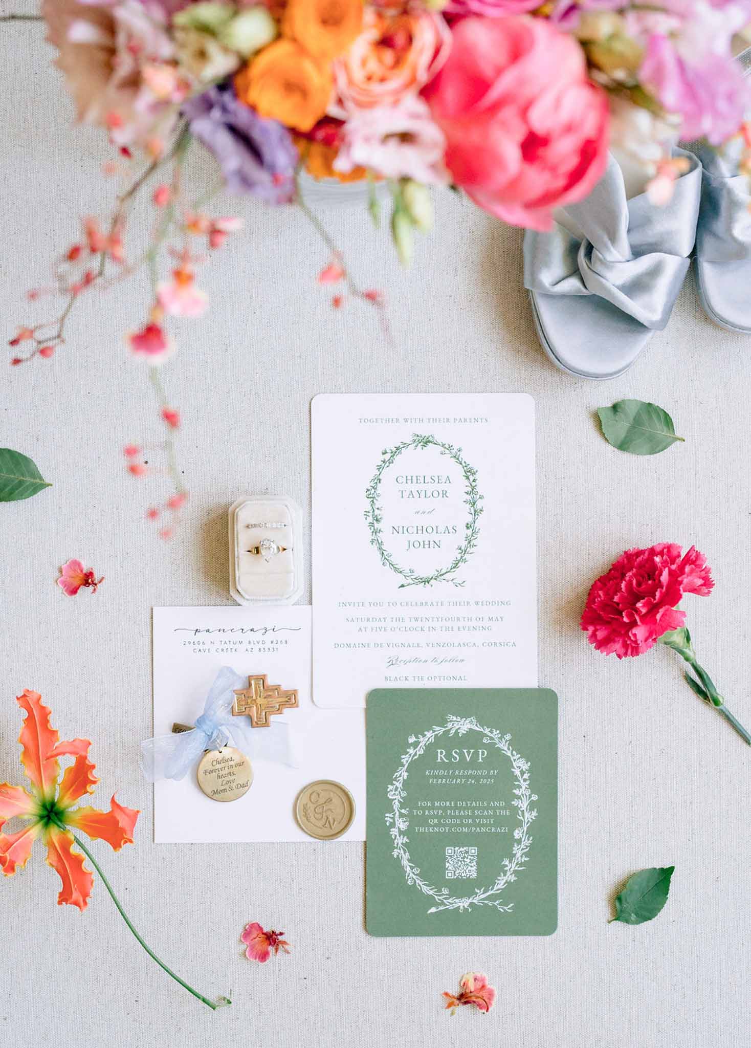 Sage green botanical invitation with hot pink peonies, orange roses, powder blue bow heels, and gold seal