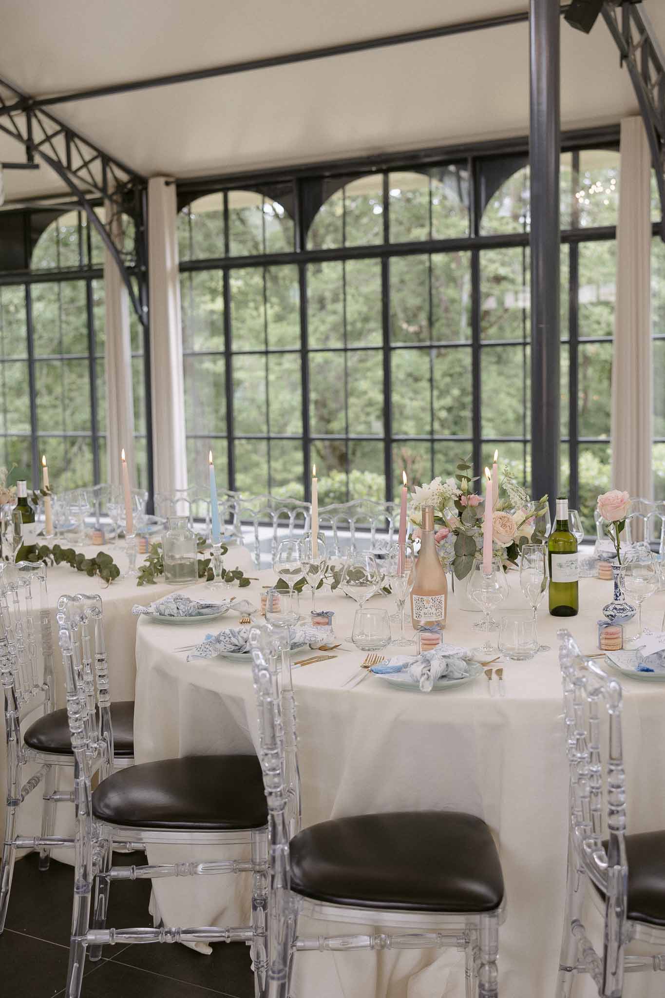 Wedding reception table setting in a garden with white roses