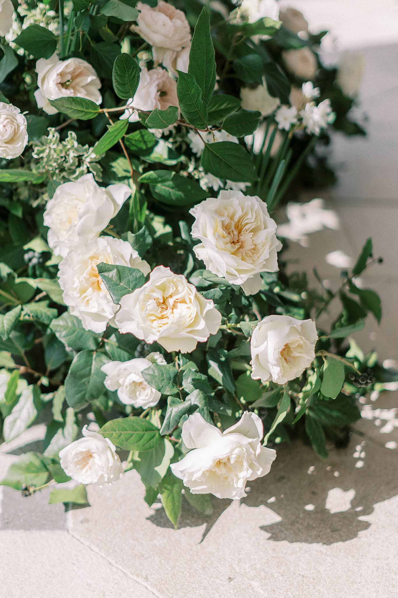 Floral arrangement in a garden with white roses
