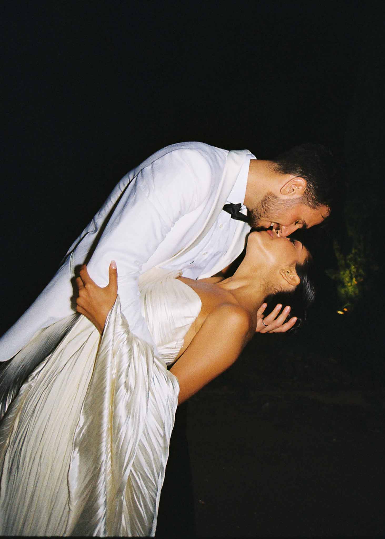 Bride and groom kissing