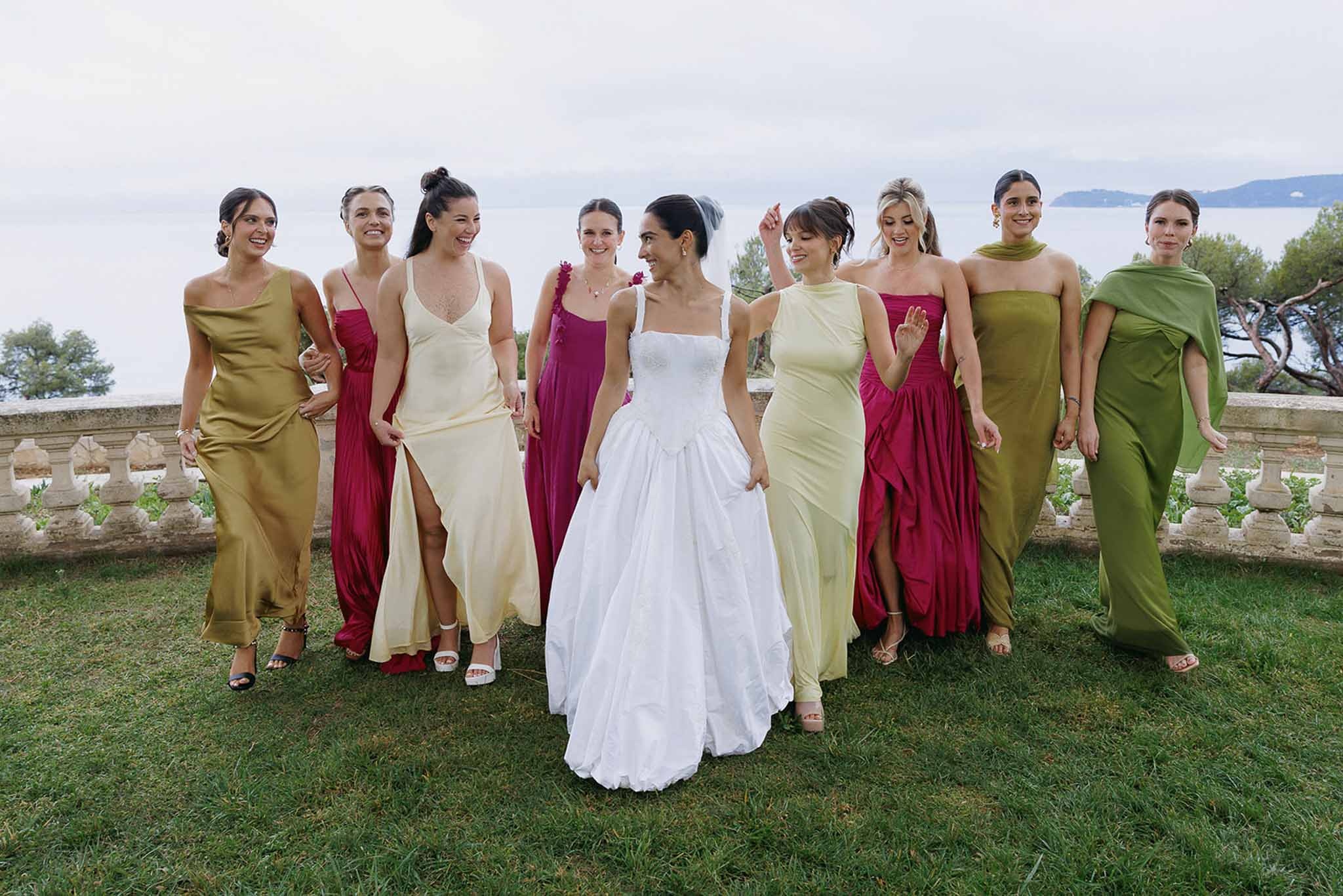 Bride and bridesmaids walking with sea view at Domaine Rocabella, Cote d'Azur