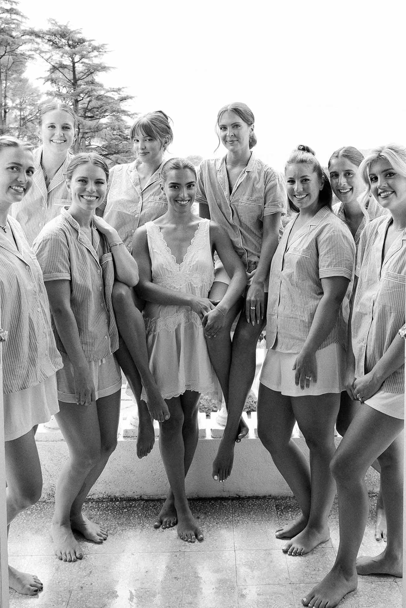 Bride and bridesmaids in pyjamas on balcony at Domaine Rocabella, Cote d'Azur