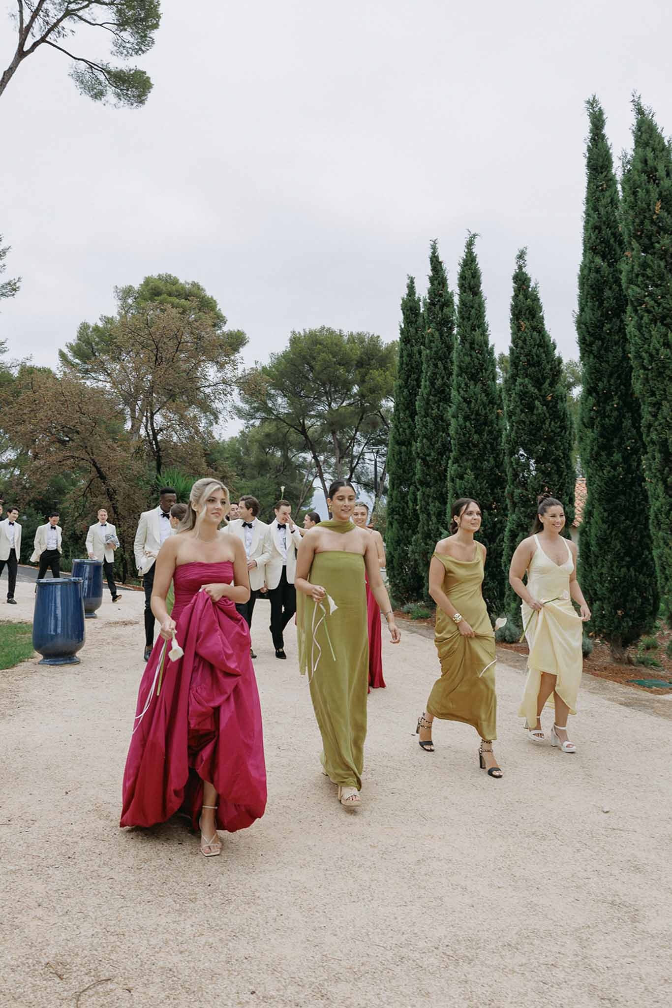 Bridesmaids and groomsmen walking gravel path at Domaine Rocabella, Cote d'Azur