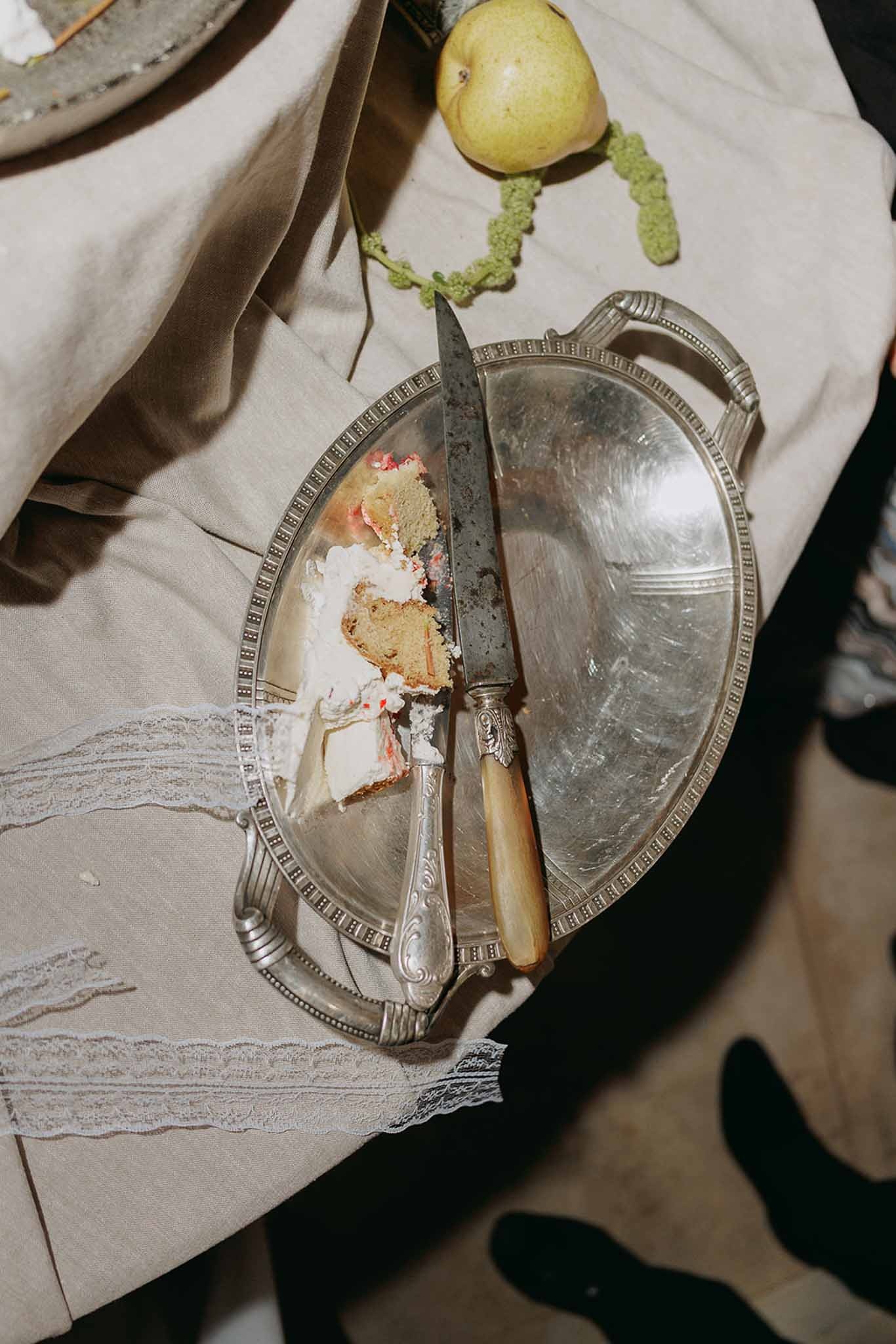 Cake slice on silver platter with antique knife at Domaine Rocabella, Cote d'Azur