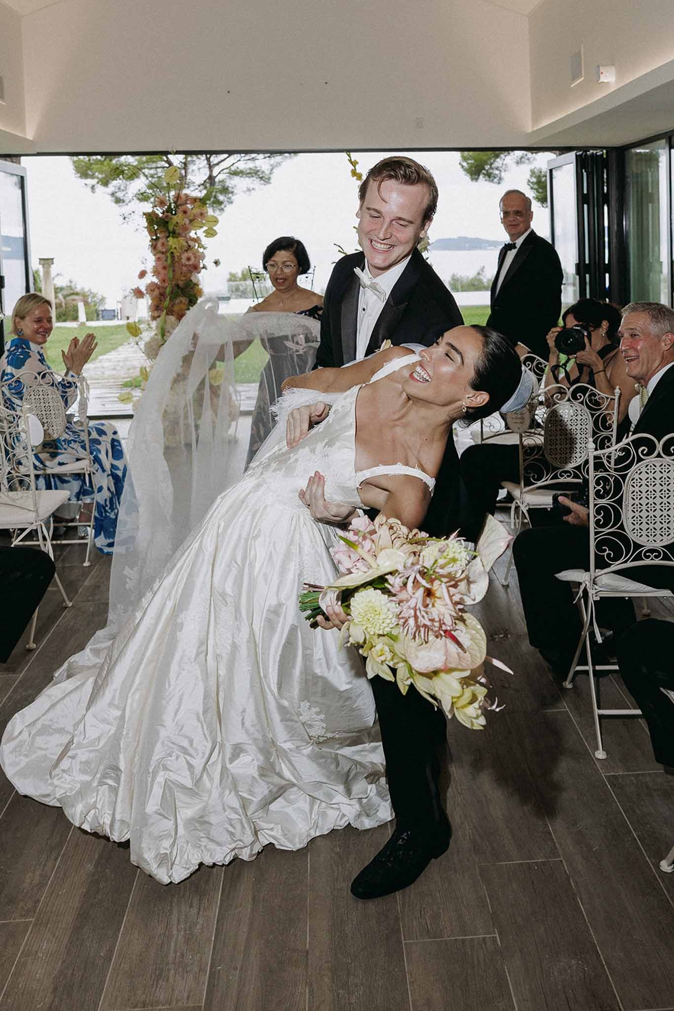 Groom dipping bride down the aisle at Domaine Rocabella, Cote d'Azur