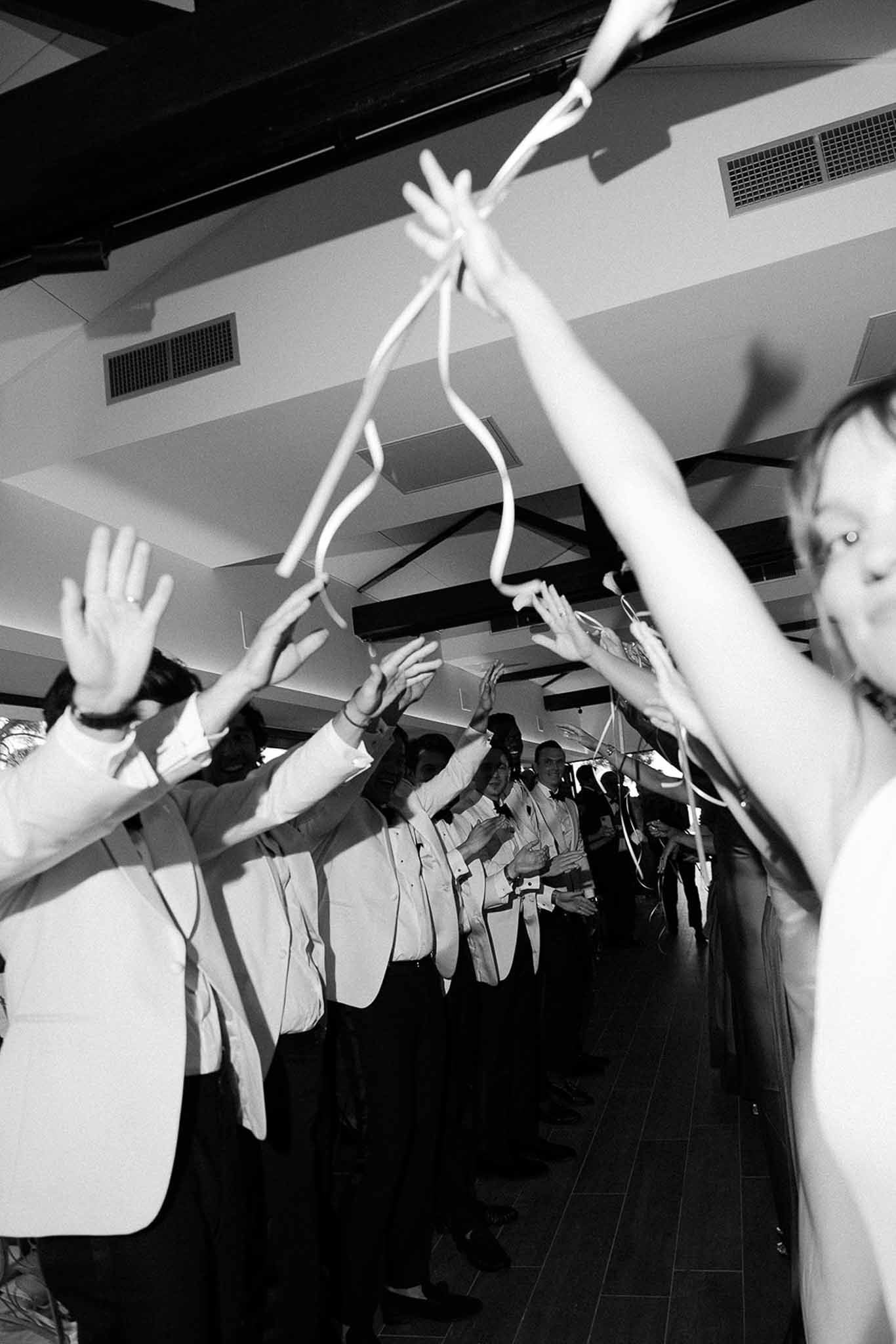 Guests forming celebratory flower canopy at Domaine Rocabella, Cote d'Azur