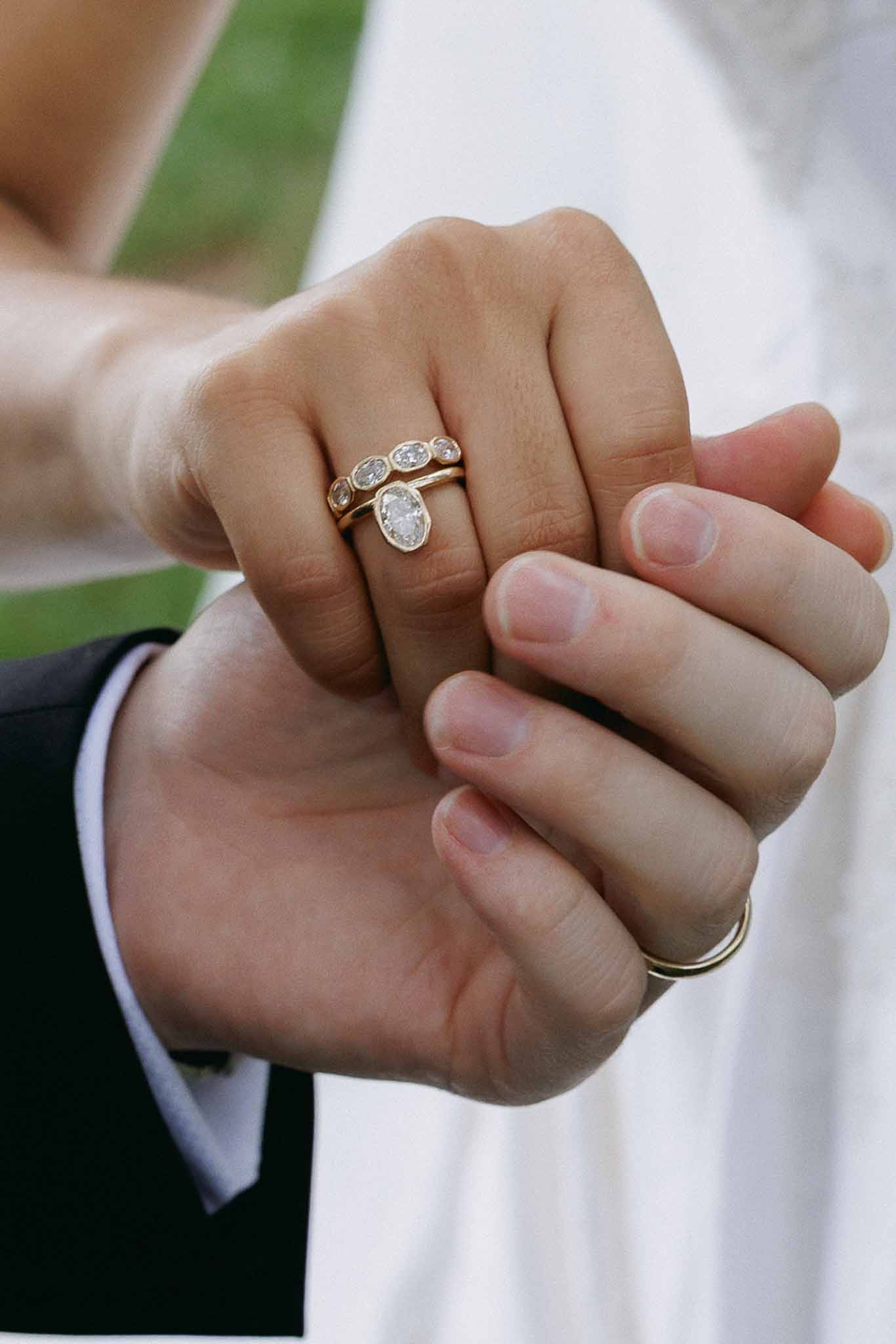 Close up of couple's hands and diamond rings at Domaine Rocabella, Cote d'Azur