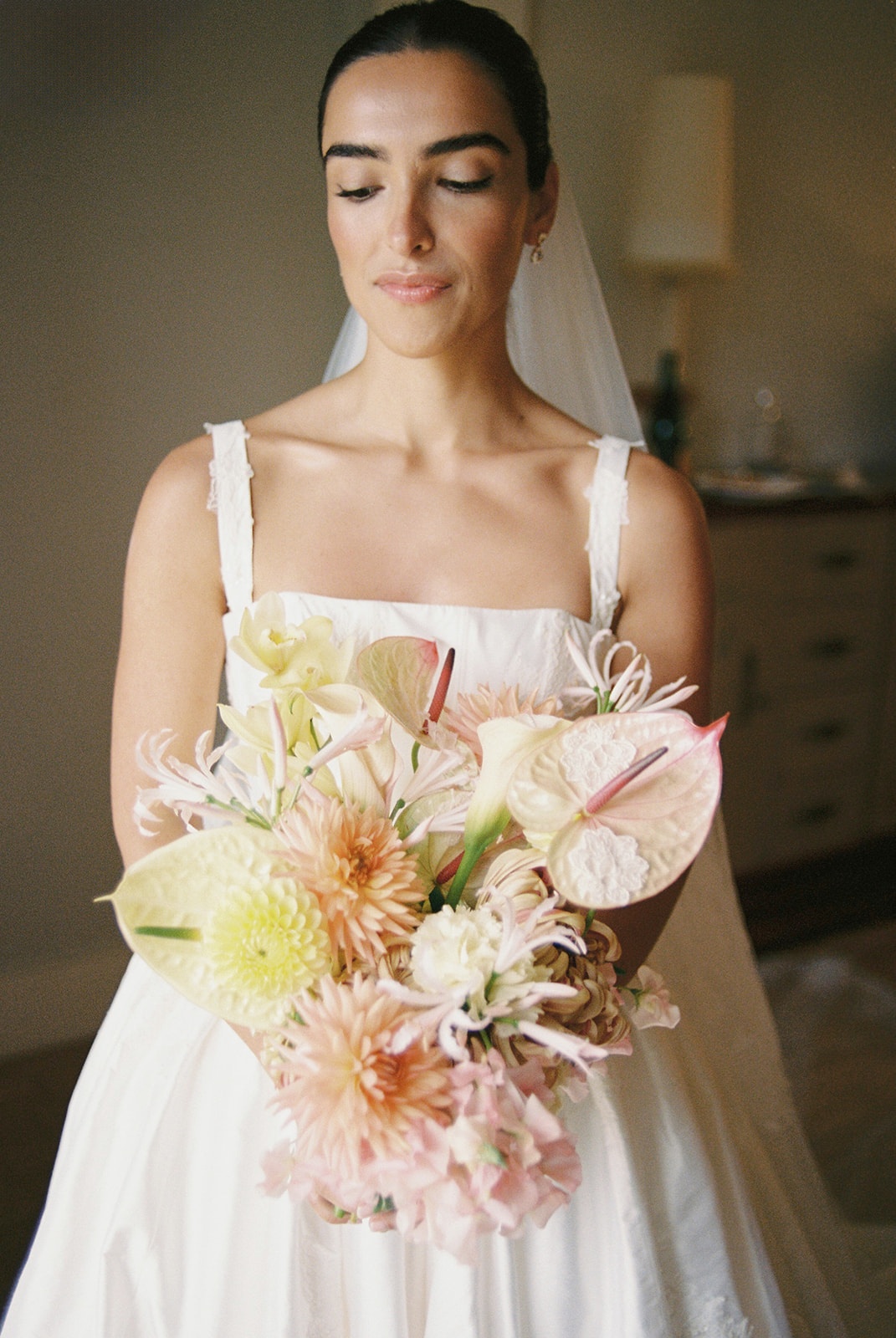 Bride with anthurium bouquet at Domaine Rocabella