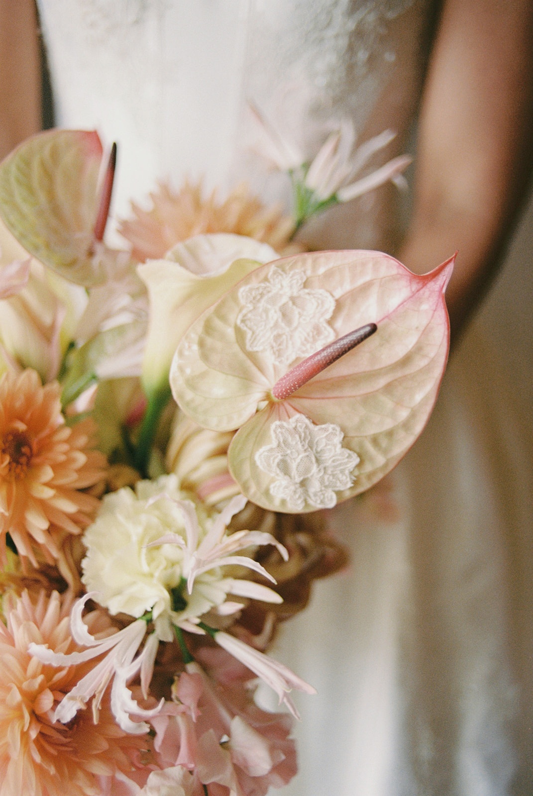 Anthurium and dahlia bridal bouquet close-up at Domaine Rocabella