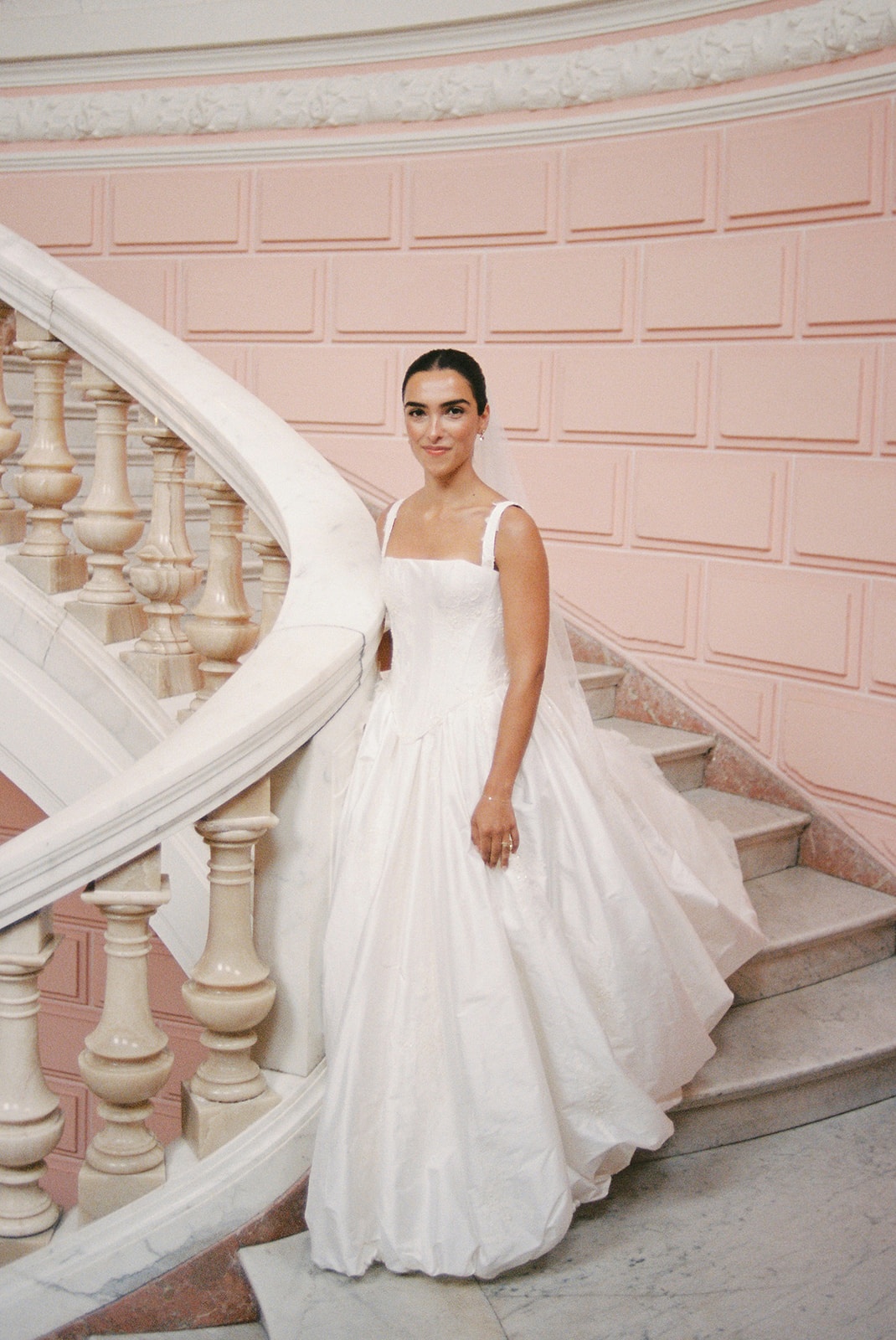 Bride on curved staircase at Domaine Rocabella