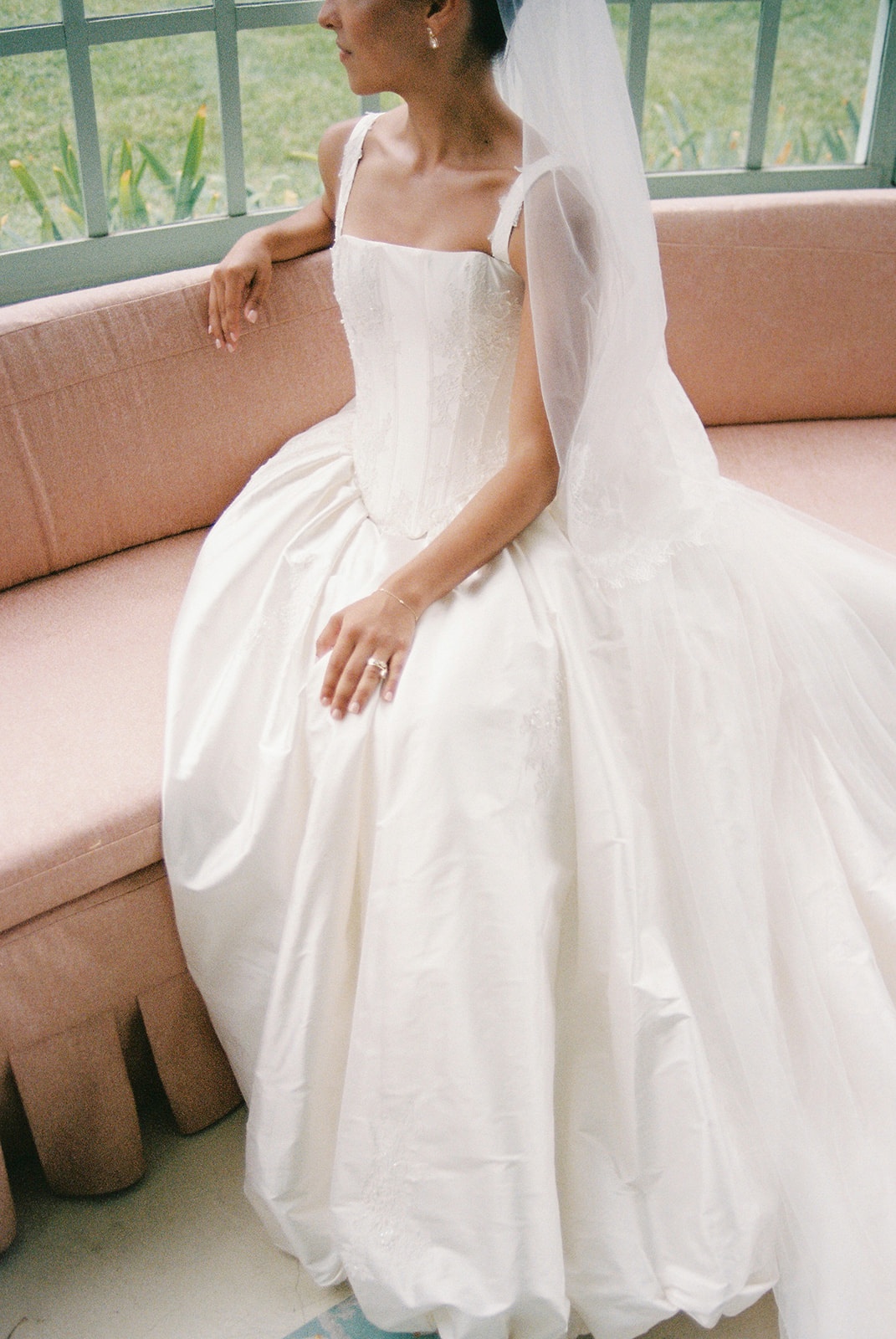 Bridal gown detail on pink sofa at Domaine Rocabella
