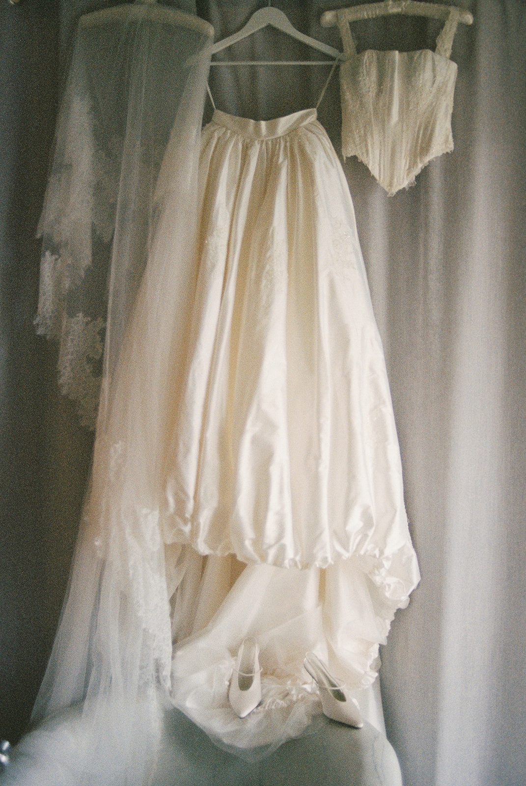 Wedding dress and veil hanging at Domaine Rocabella