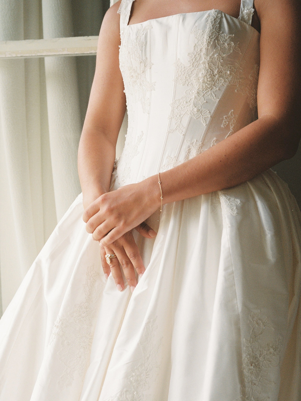 Bridal gown lace detail and engagement ring at Domaine Rocabella