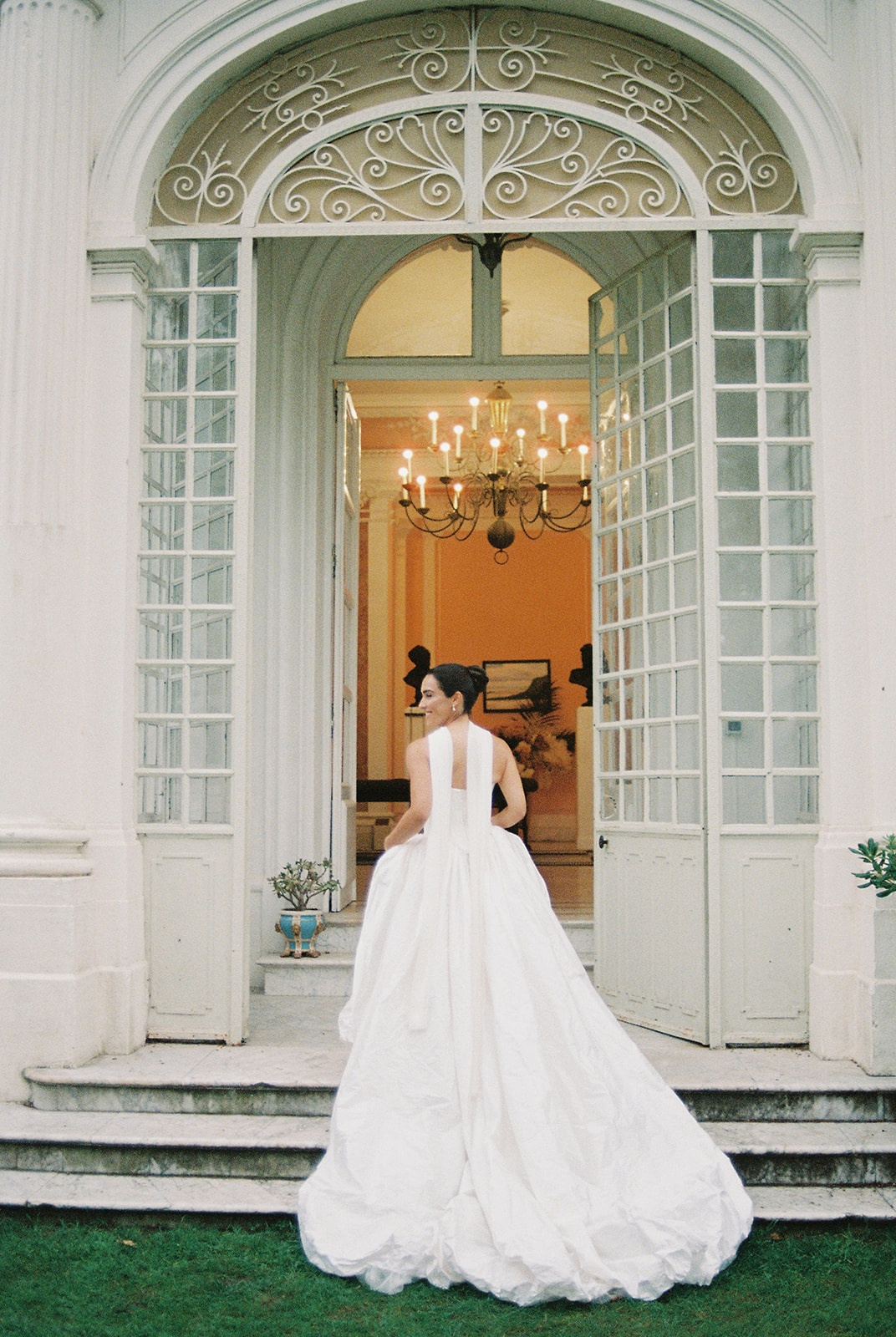 Bride in orangery doorway at Domaine Rocabella