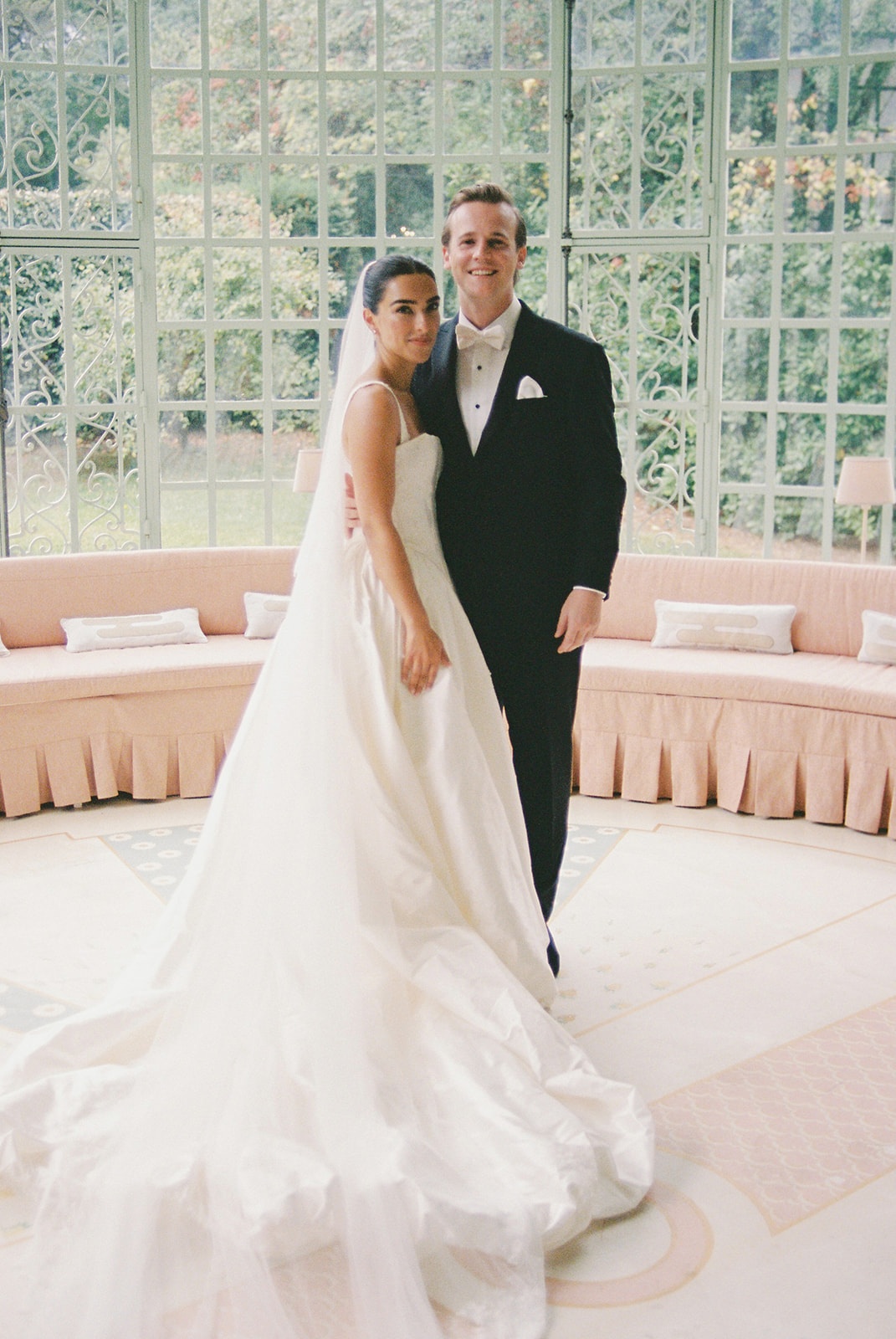 Couple portrait in glass conservatory at Domaine Rocabella