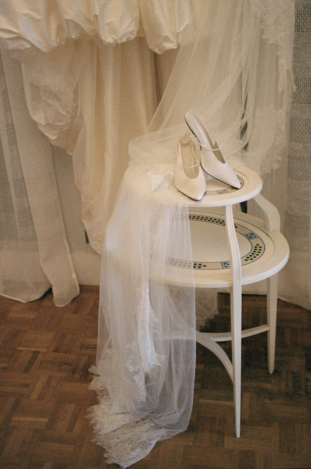 Bridal shoes and veil on vintage table at Domaine Rocabella
