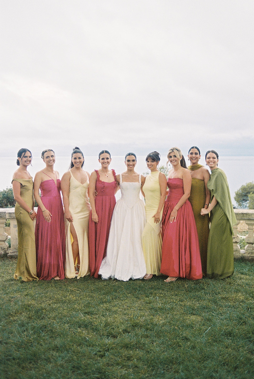 Bride and bridesmaids in colourful silk gowns at Domaine Rocabella