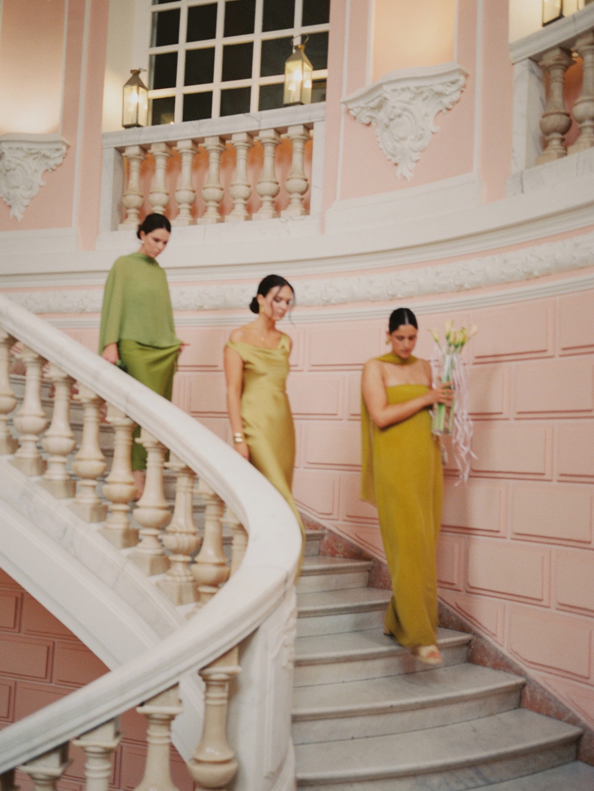 Bridesmaids on pink staircase at Domaine Rocabella