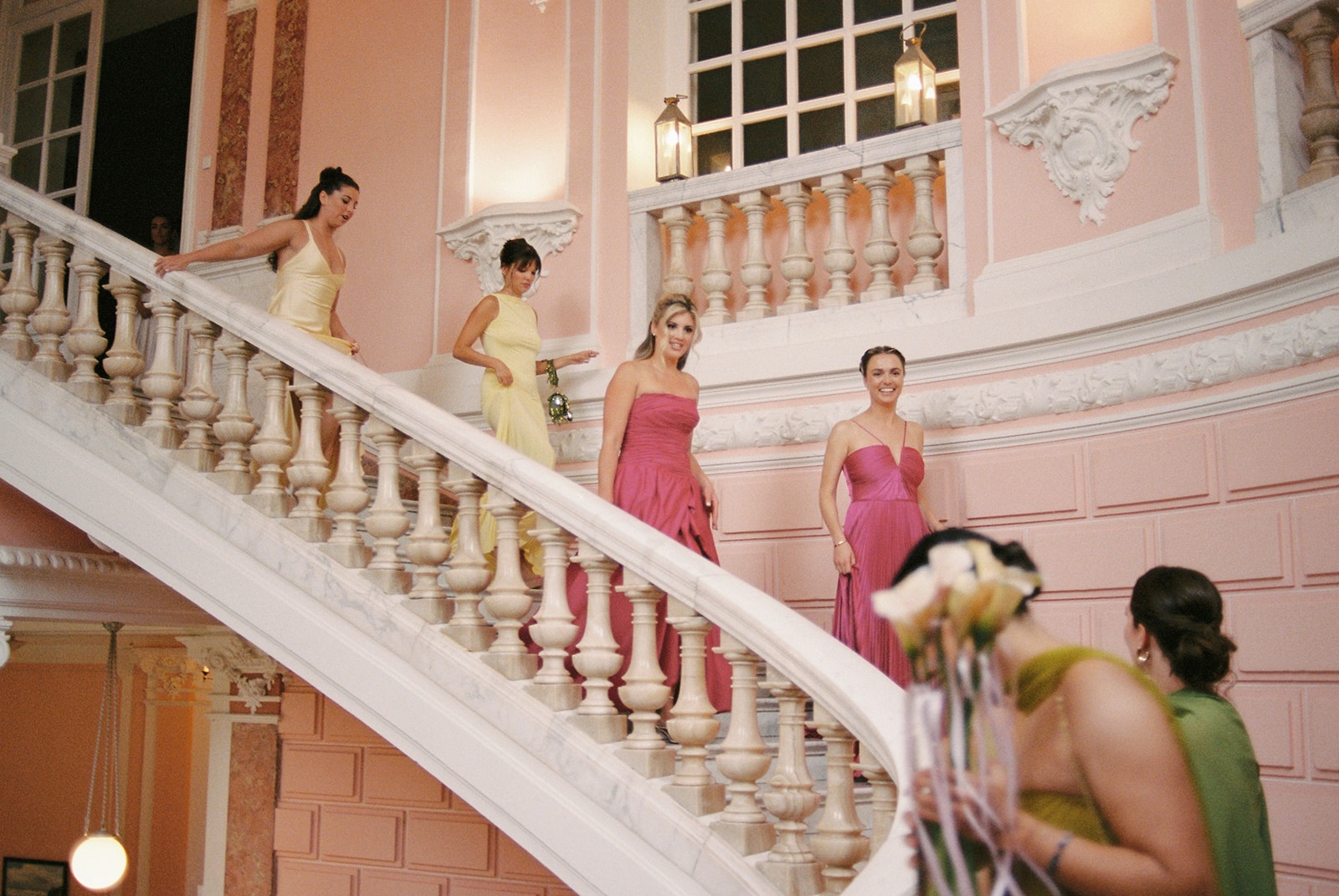 Bridesmaids on pink marble staircase at Domaine Rocabella
